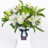 A Gorgeously simple bouquet of white & Green Lilies, Roses, Hydrangea, Lisisanthus & Wax flower by The gorgeous flower co