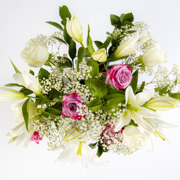 A gorgeous combination of White Lilies with White and Pink Roses and Gypsophelia top view by The gorgeous flower co